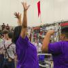 Sunset High School special education teacher Pauline Tatum (middle) cheers along with her students as RoboFlash is announced during the Dallas Regional FIRST Robotics Competition on March 11. Photo: Heather Noel